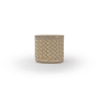 Light sepia colored 3D printed ceramic planter with a zig zag pattern, on a white background