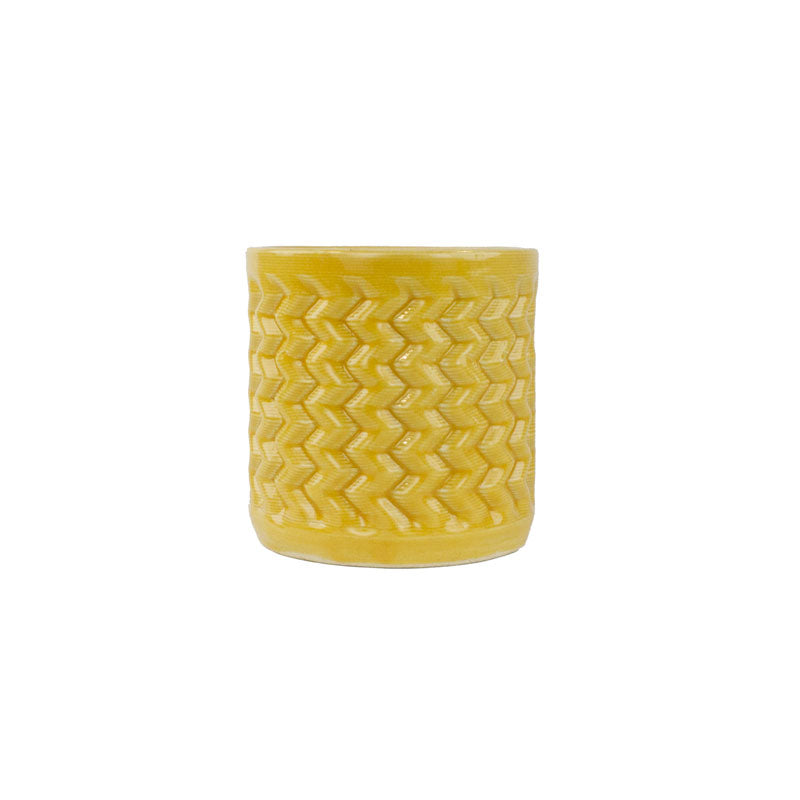 Marigold colored 3D printed ceramic planter with a zig zag pattern, on a white background