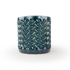 Storm colored 3D printed ceramic planter with a zig zag pattern, on a white background