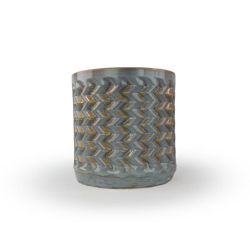 Light sepia colored 3D printed ceramic planter with a zig zag pattern, on a white background