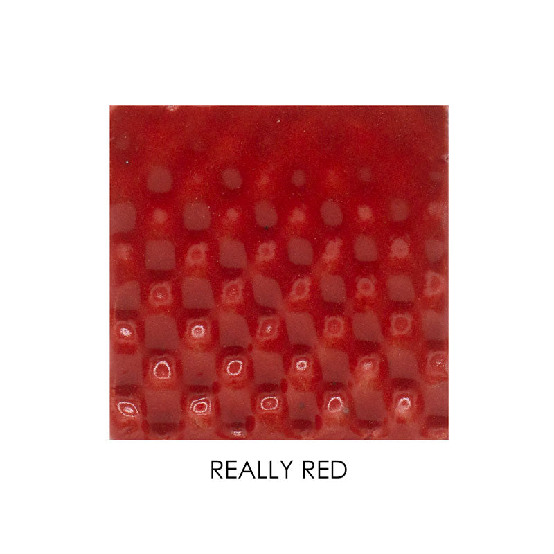 Red textured square tile with 'REALLY RED' text on a white background