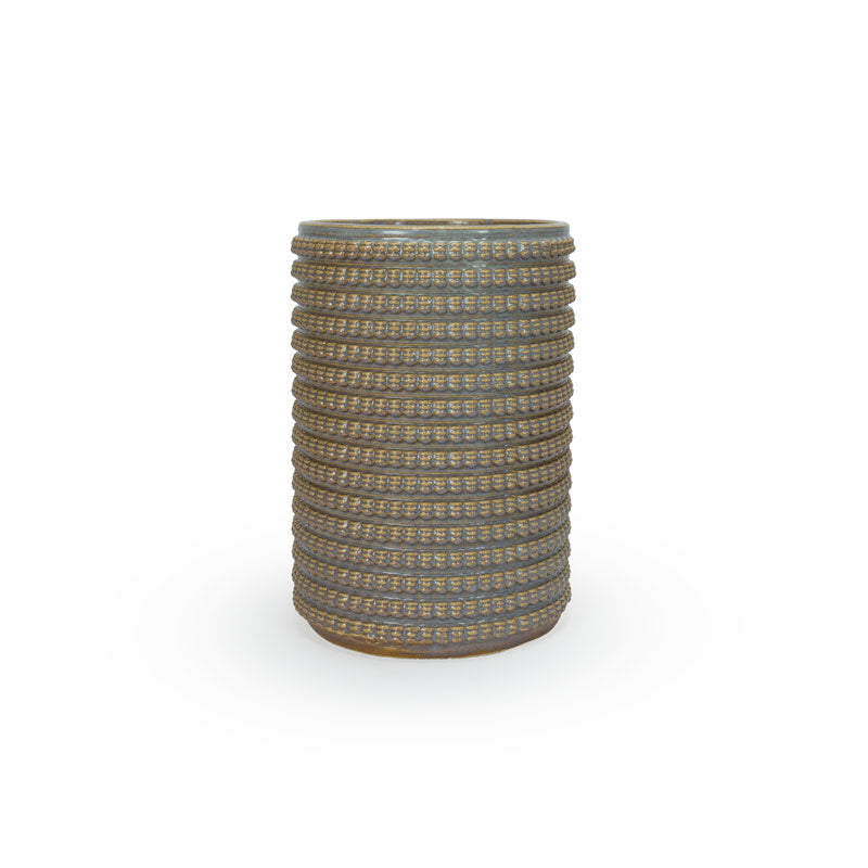 Light sepia colored 3D printed ceramic vase with a micro scallop pattern, on a white background