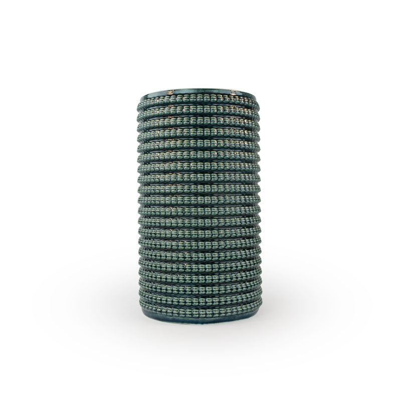 Storm colored 3D printed ceramic vase with a micro scallop pattern, on a white background