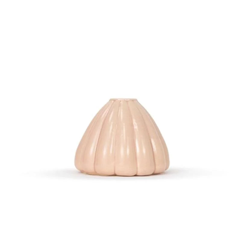 Light pink colored 3D printed ceramic bud vase with an urchin pattern, on a white background