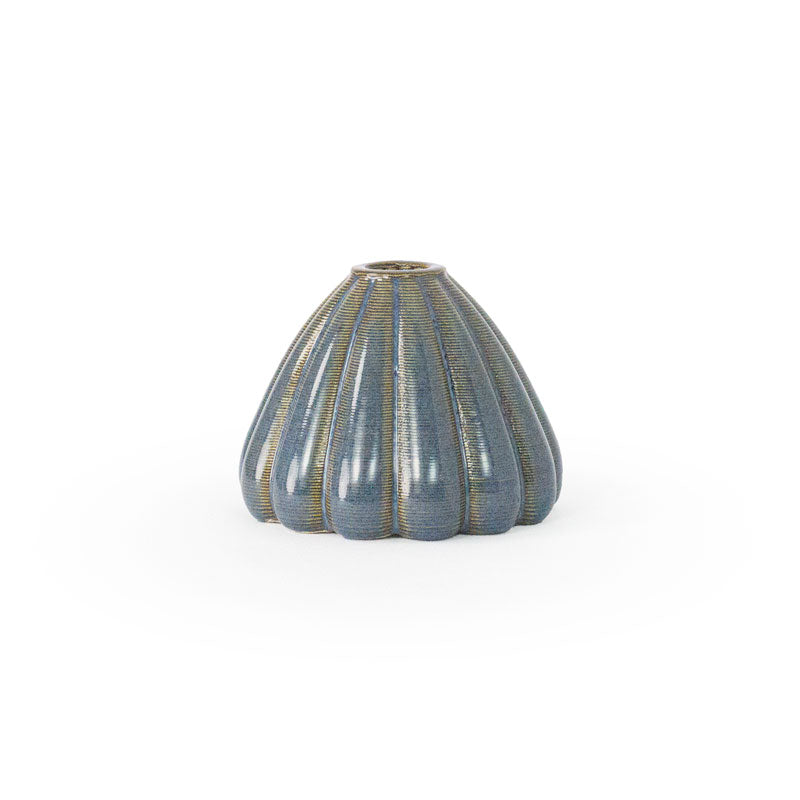 Blue rutile colored 3D printed ceramic bud vase with an urchin pattern, on a white background