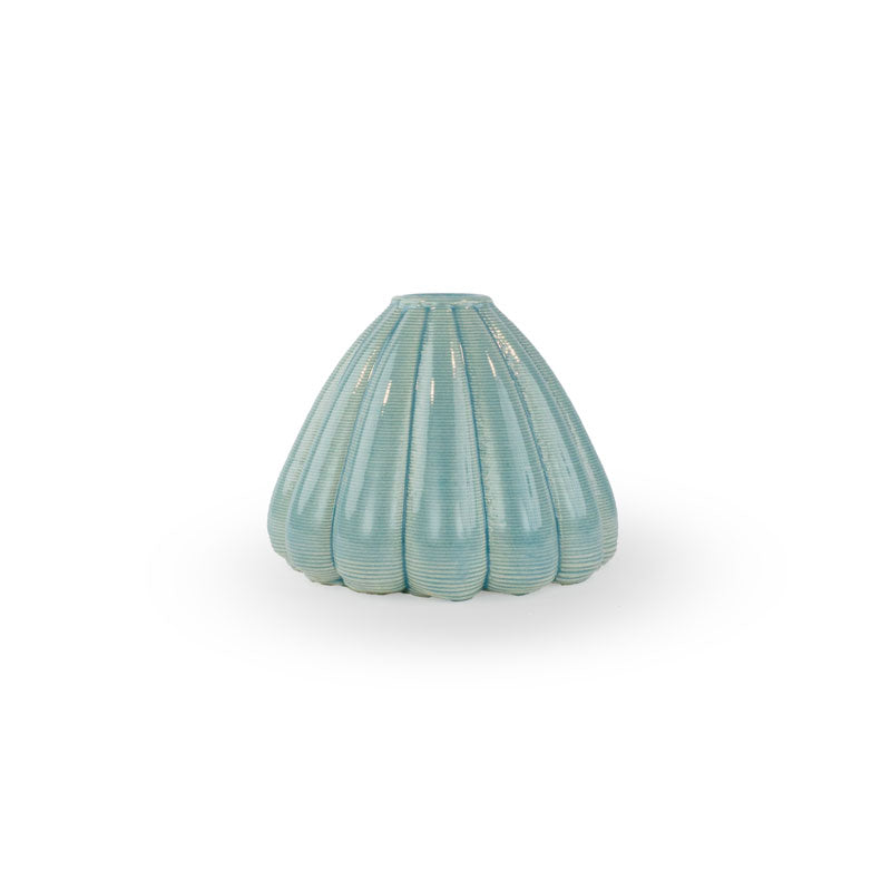 Lagoon colored 3D printed ceramic bud vase with an urchin pattern, on a white background
